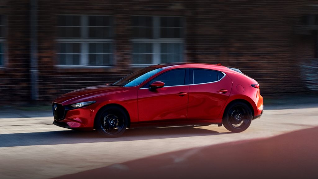 Red Mazda on road