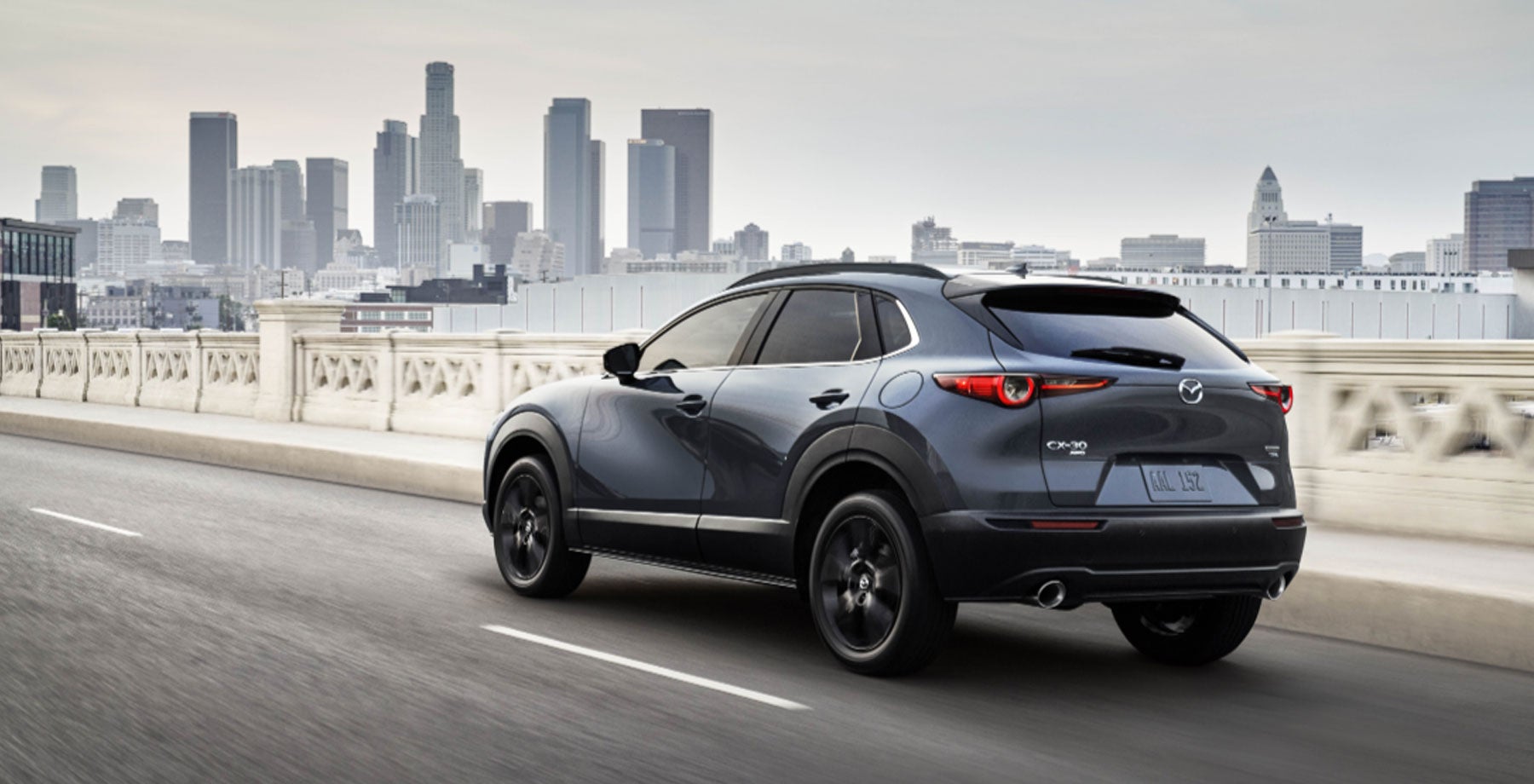 Mazda CX-30 driving through the city